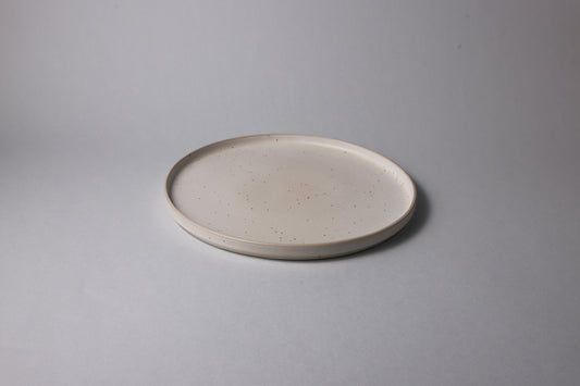 Large stoneware plate with matte finish, beige