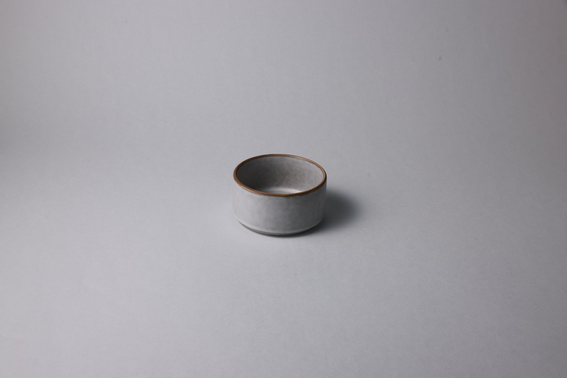 Small stoneware bowl with matte finish, soft gray