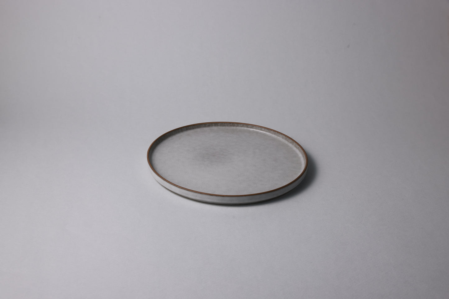 Medium stoneware plate with matte finish, soft gray