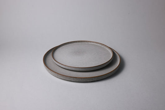 Two stoneware plates with matte finish, soft gray