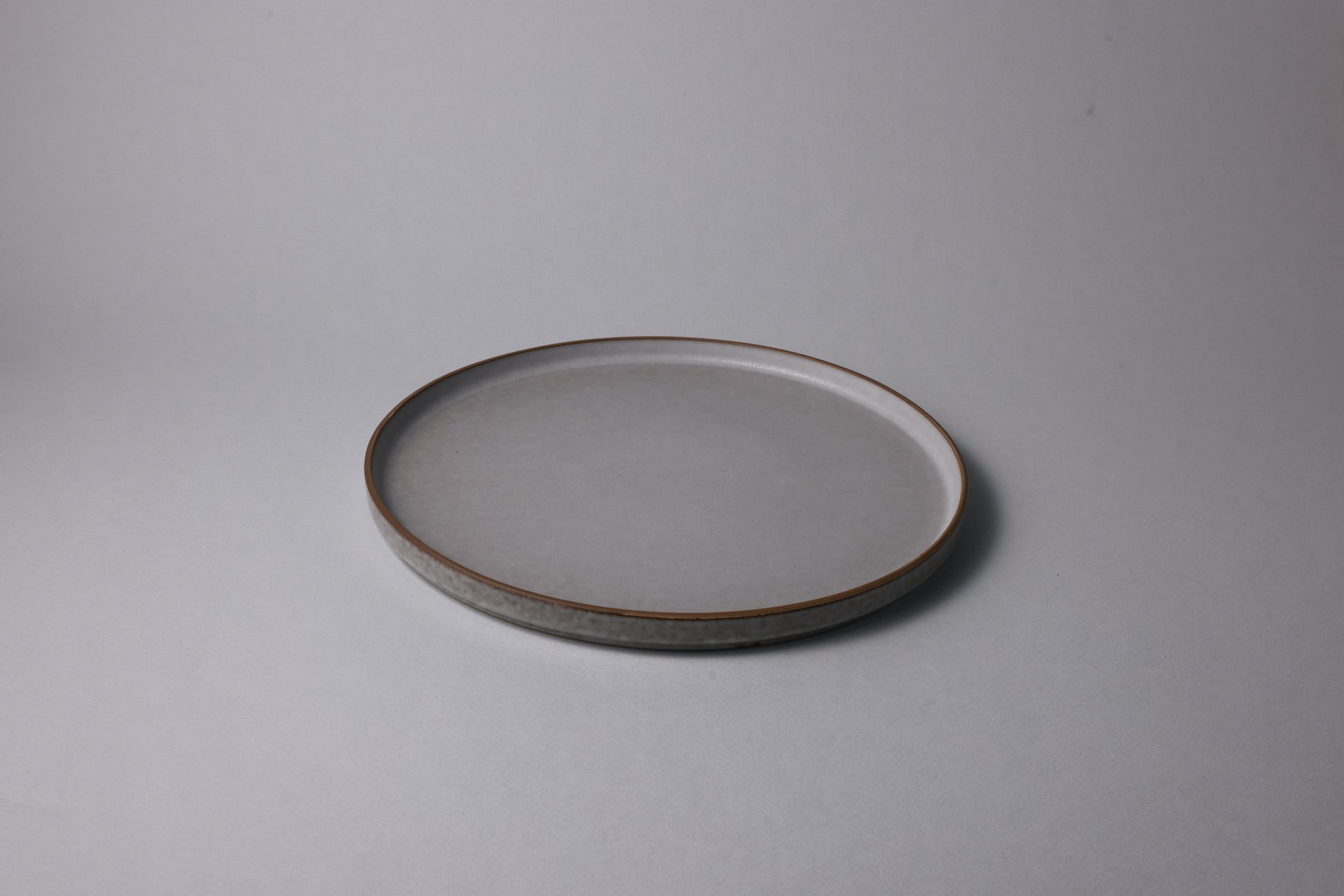 Large stoneware plate with matte finish, soft gray