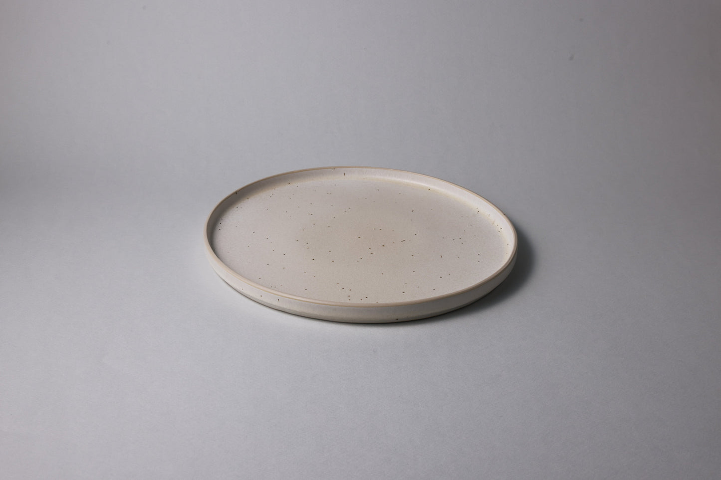 Large stoneware plate with matte finish, beige