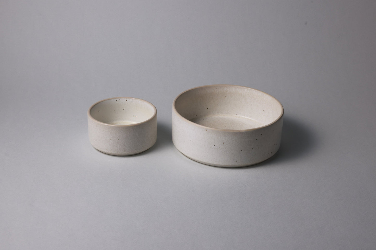 Two stoneware bowls with matte finish, warm white