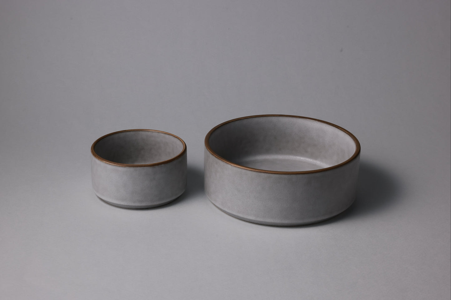Two stoneware bowls with matte finish, soft gray