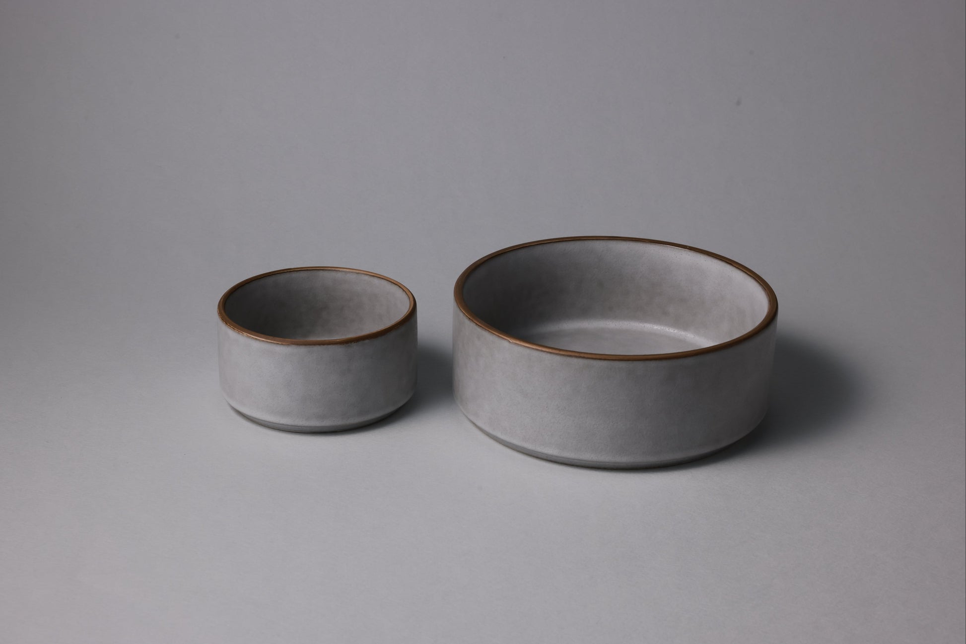Two stoneware bowls with matte finish, soft gray