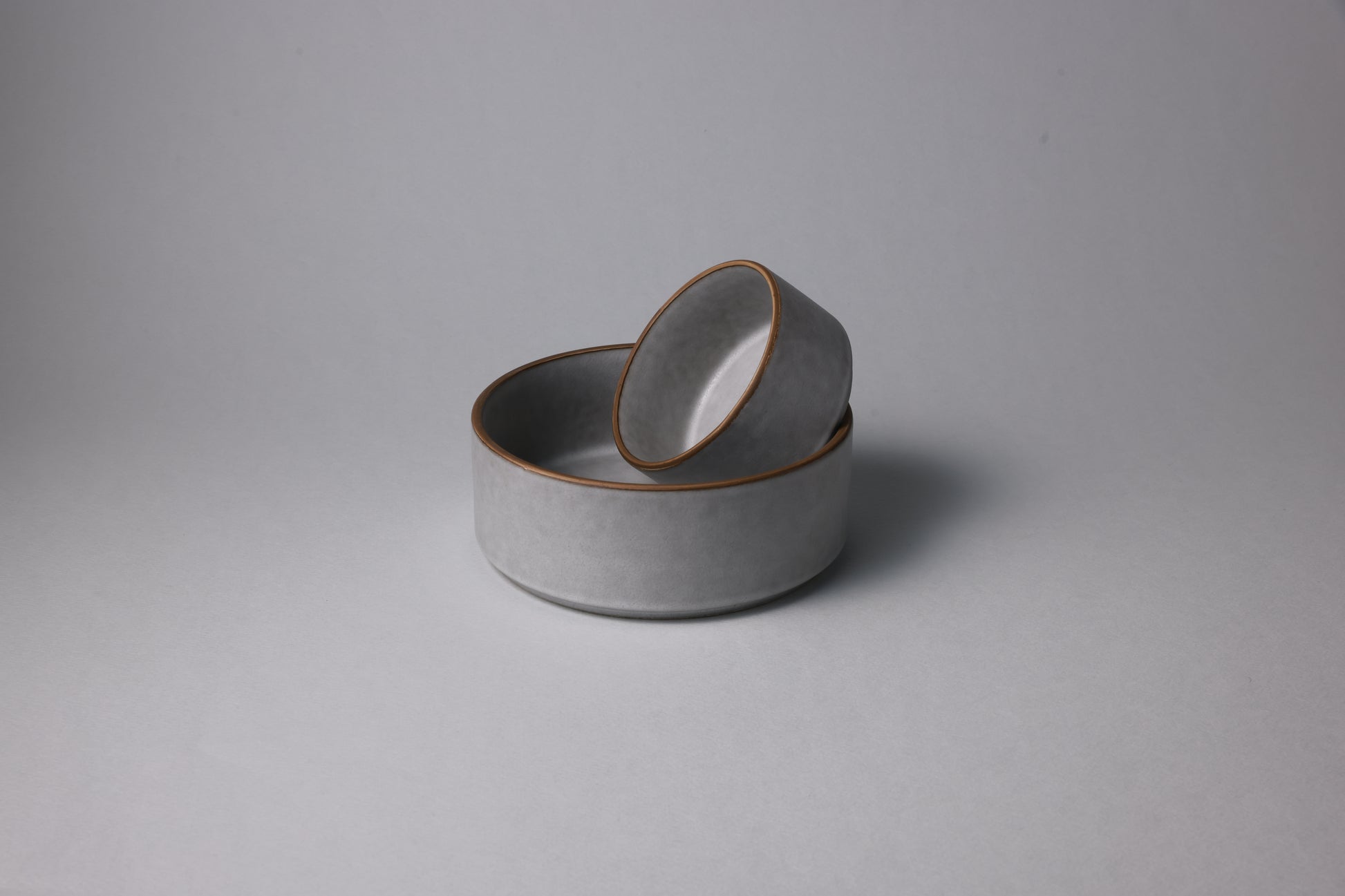 Two stoneware bowls with matte finish, soft gray