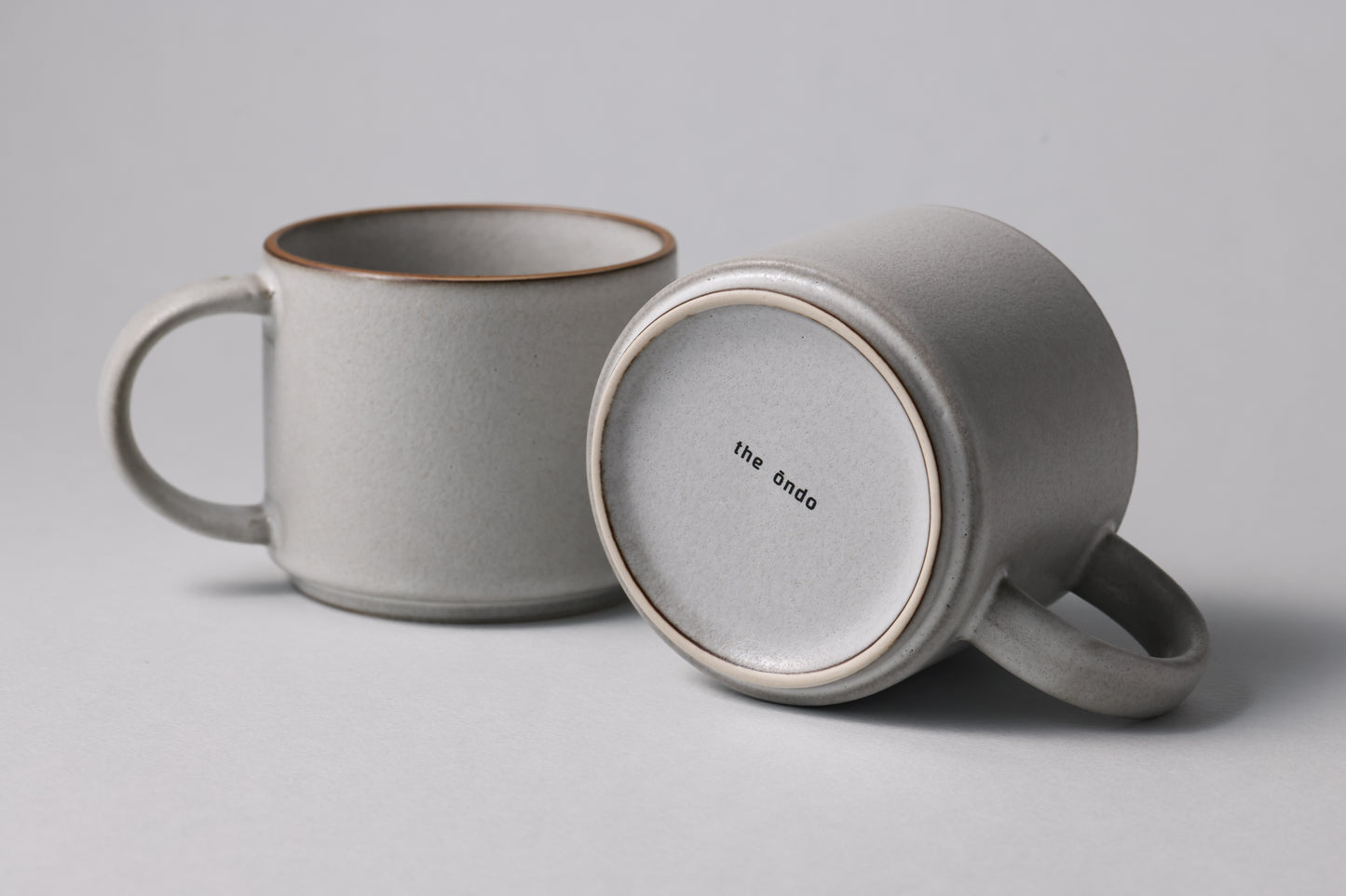 Two stoneware mugs with matte finish in soft gray